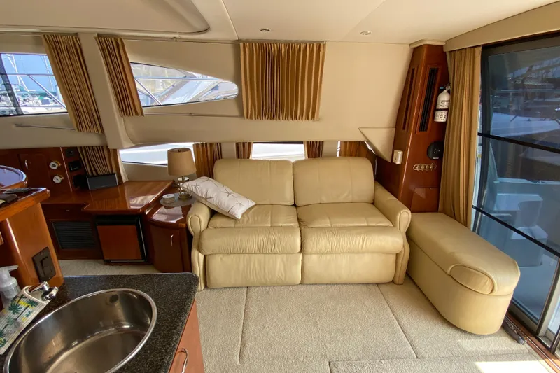 Slide: The Image of Luxurious interior of 2004 Carver 36 Super Sport yacht with beige leather sofa. - 5