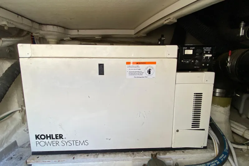 Slide: The Image of Kohler power system in 2004 Carver 36 Super Sport yacht engine room. - 52
