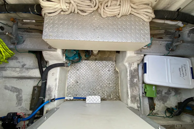 Slide: The Image of Engine room of 2004 Carver 36 Super Sport with storage and equipment. - 53