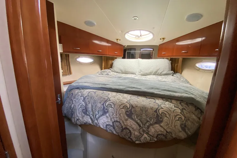 Slide: The Image of Luxurious bedroom interior of 2004 Carver 36 Super Sport yacht with elegant bedding. - 22