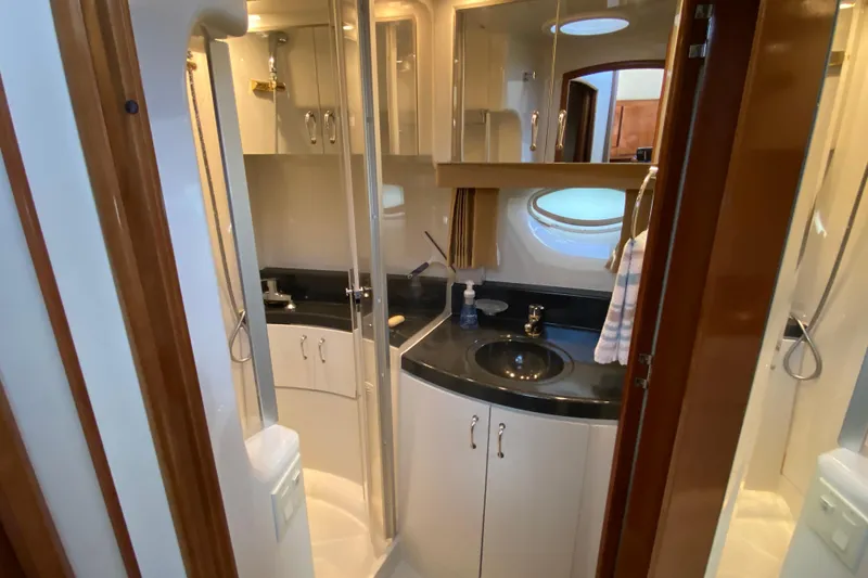 Slide: The Image of Luxurious bathroom in 2004 Carver 36 Super Sport yacht with modern fixtures and elegant design. - 26