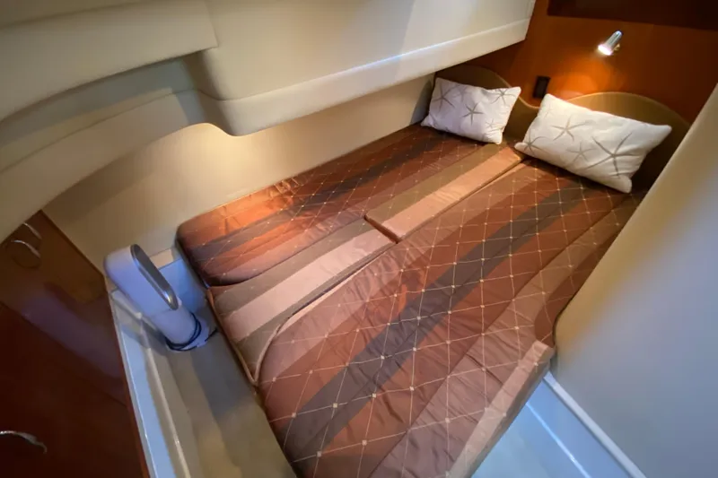 Slide: The Image of Interior cabin of 2004 Carver 36 Super Sport yacht with cozy bed and pillows. - 32