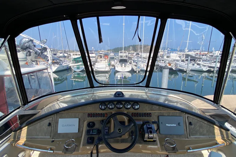 Slide: The Image of Cockpit view of 2004 Carver 36 Super Sport yacht in marina. - 35