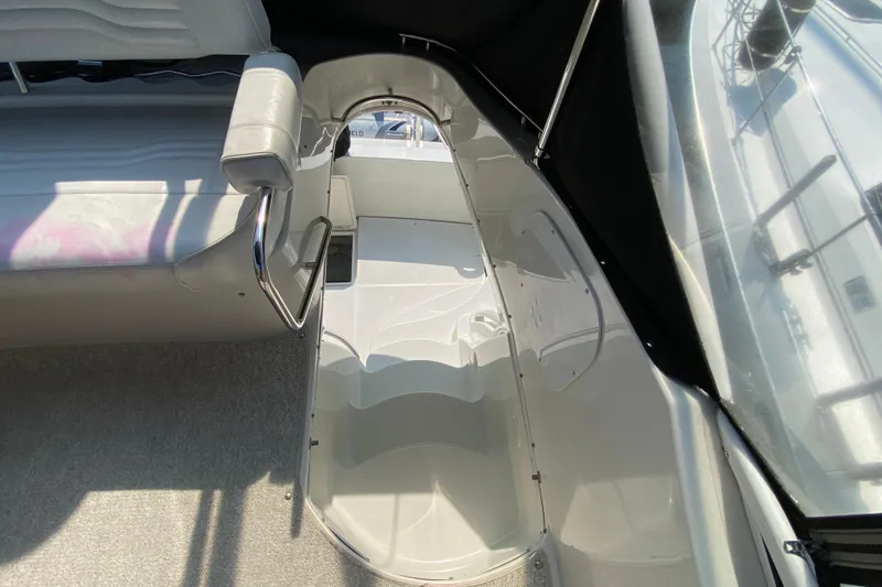 Slide: The Image of Interior view of 2004 Carver 36 Super Sport boat, featuring seating and sleek design. - 45