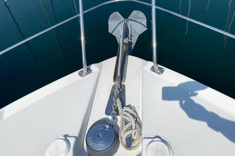 Slide: The Image of Bow of 2004 Carver 36 Super Sport with anchor and rope. - 48
