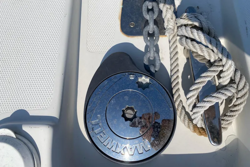 Slide: The Image of Anchor windlass and rope on 2004 Carver 36 Super Sport boat deck. - 49