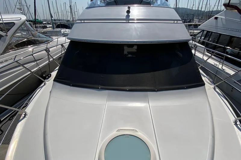 Slide: The Image of 2004 Carver 36 Super Sport yacht docked at marina, front view. - 51