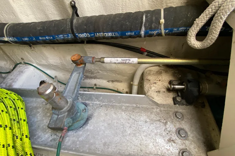 Slide: The Image of Engine compartment of a 2004 Carver 36 Super Sport boat, showing mechanical components. - 56