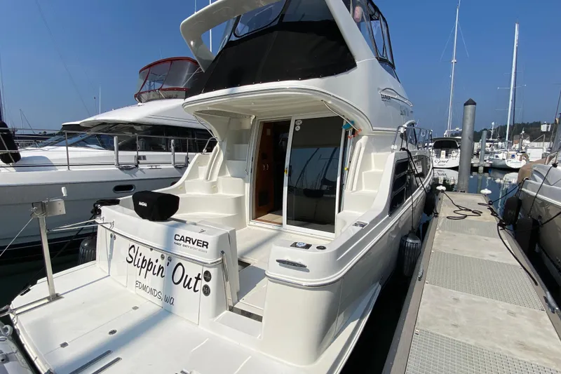 Slide: The Image of 2004 Carver 36 Super Sport yacht docked at marina, rear view. - 70