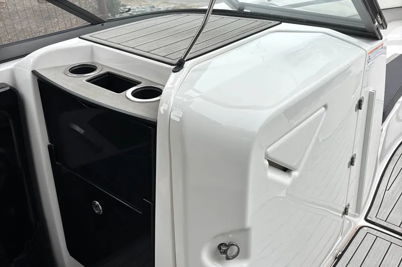 Slide: The Image of 2022 Yamaha Boats 252S interior with cup holders and sleek design. - 11