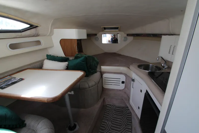 Slide: The Image of Interior of a 1996 Monterey 296 Cruiser with dining area and kitchenette. - 11