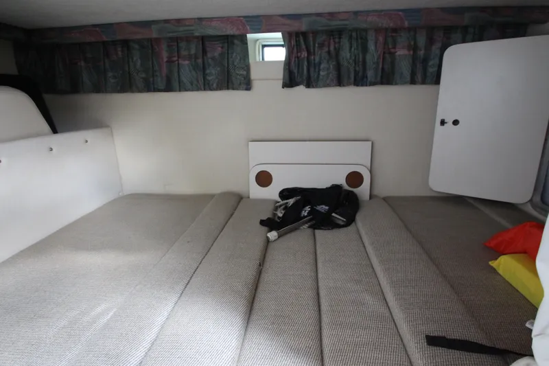 Slide: The Image of Interior cabin of 1996 Monterey 296 Cruiser with bed and storage compartments. - 15