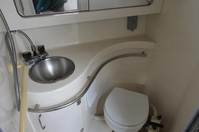 Slide: The Image of Bathroom interior of 1996 Monterey 296 Cruiser with sink and toilet. - 17