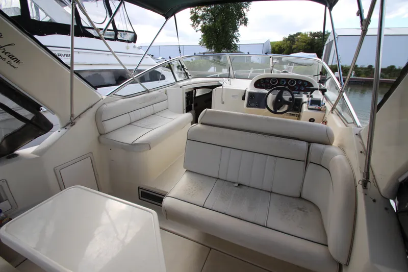 Slide: The Image of Interior view of a 1996 Monterey 296 Cruiser boat with seating and steering area. - 3