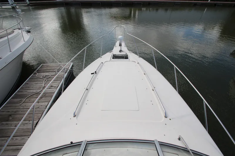 Slide: The Image of 1996 Monterey 296 Cruiser boat docked at marina, viewed from bow. - 7