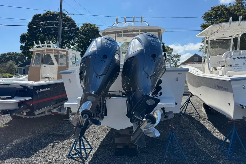 Slide: The Image of 2025 NorthCoast 255 HT boat with dual outboard engines on display. - 17