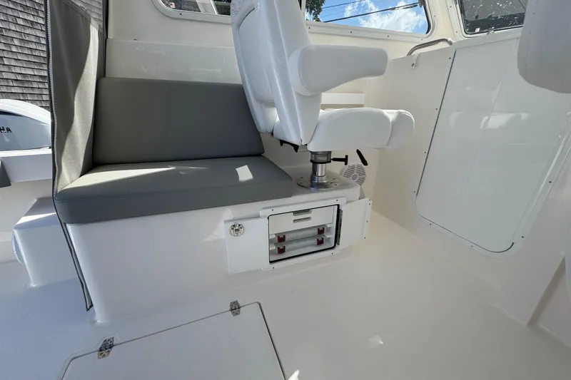 Slide: The Image of Interior of 2025 NorthCoast 255 HT boat with seating and storage. - 23