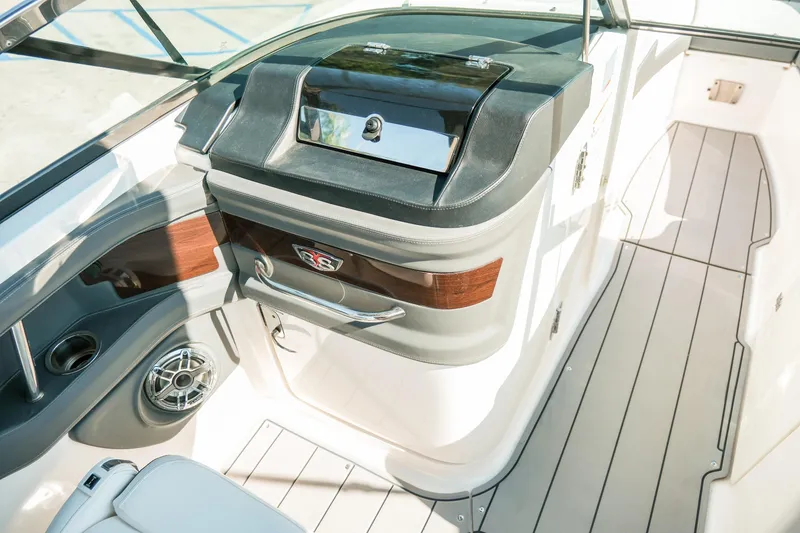 Slide: The Image of 2023 Chaparral 287 SSX boat interior with sleek design and modern amenities. - 12