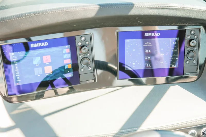 Slide: The Image of Simrad displays on 2023 Chaparral 287 SSX boat dashboard, showing navigation and performance data. - 21
