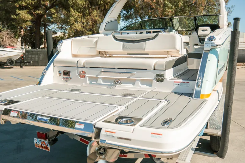 Slide: The Image of 2023 Chaparral 287 SSX boat with spacious deck and luxurious seating. - 27