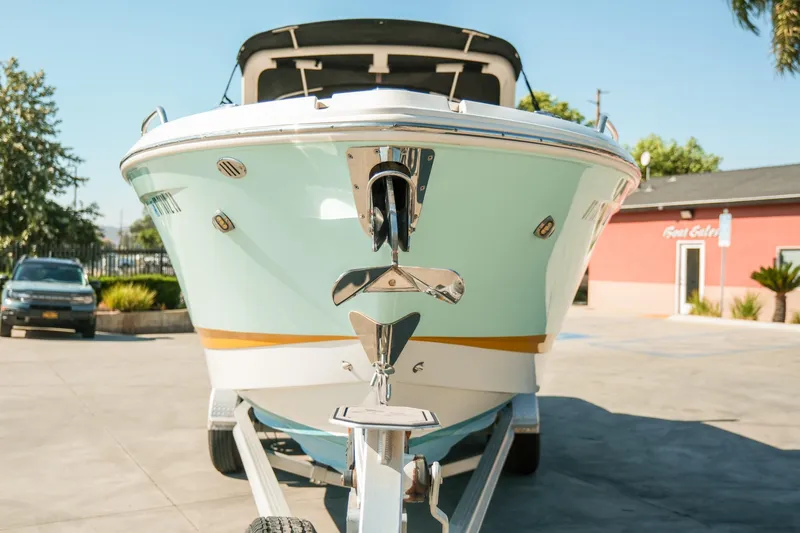 Slide: The Image of 2023 Chaparral 287 SSX boat on trailer, front view in sunny outdoor setting. - 29