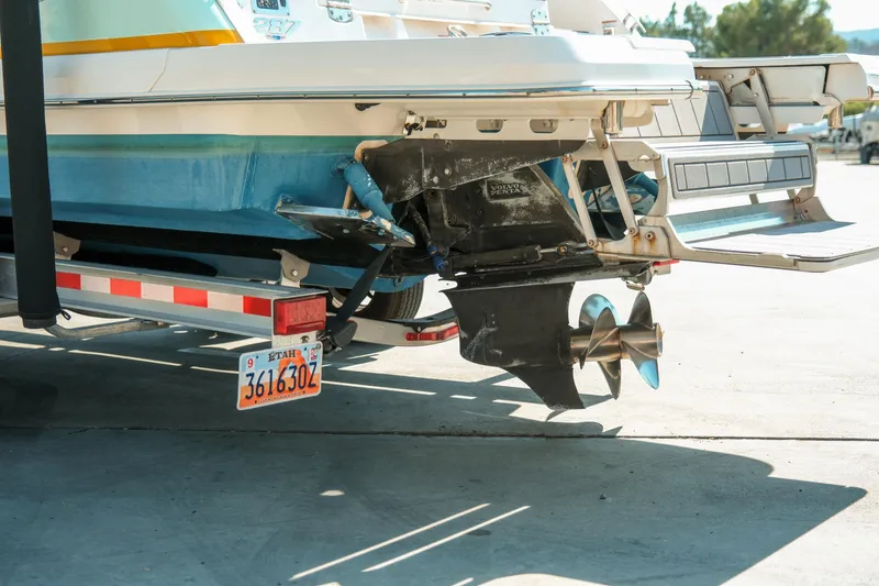 Slide: The Image of 2023 Chaparral 287 SSX boat on trailer, rear view with propeller and Utah license plate. - 4