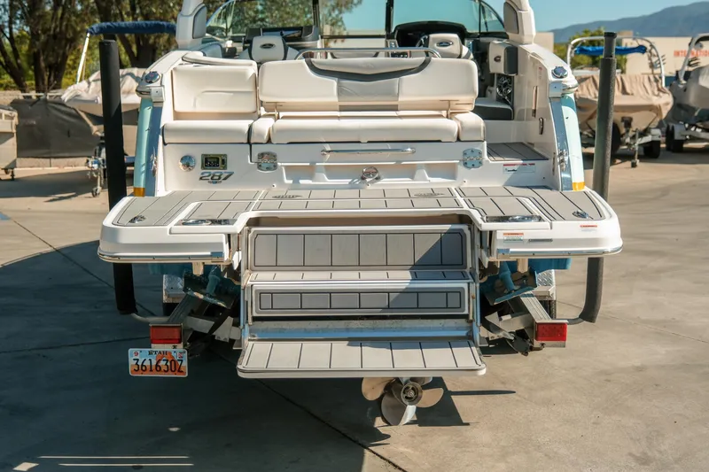 Slide: The Image of 2023 Chaparral 287 SSX boat rear view with extended swim platform. - 5