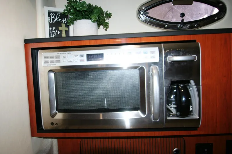 Slide: The Image of Microwave and coffee maker in 2007 Sea Ray 320 Sundancer yacht kitchen. - 11