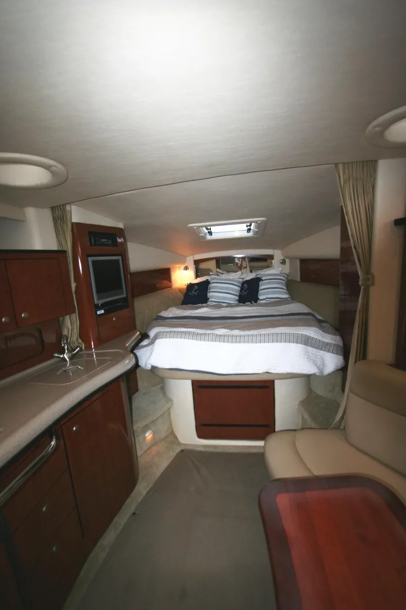 Slide: The Image of Interior of 2007 Sea Ray 320 Sundancer yacht with cozy cabin and modern amenities. - 15