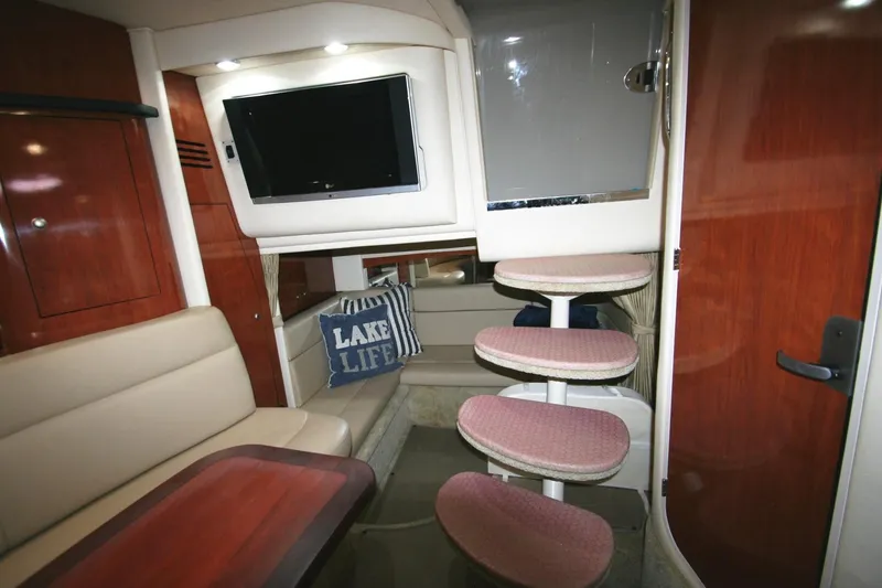 Slide: The Image of Interior of 2007 Sea Ray 320 Sundancer yacht with seating, TV, and steps. - 17
