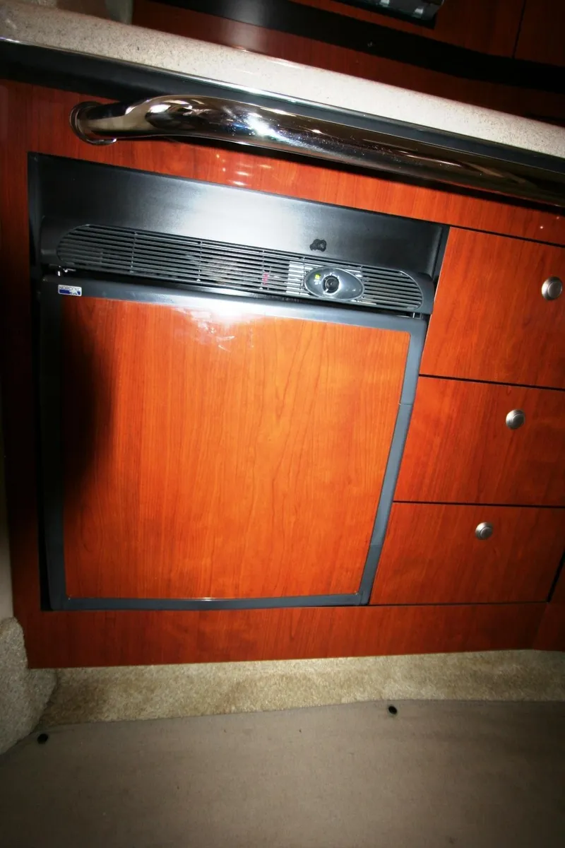 Slide: The Image of Open refrigerator in 2007 Sea Ray 320 Sundancer boat interior. - 19