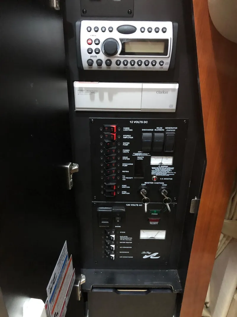 Slide: The Image of 2007 Sea Ray 320 Sundancer cockpit with white seating and modern dashboard. - 32