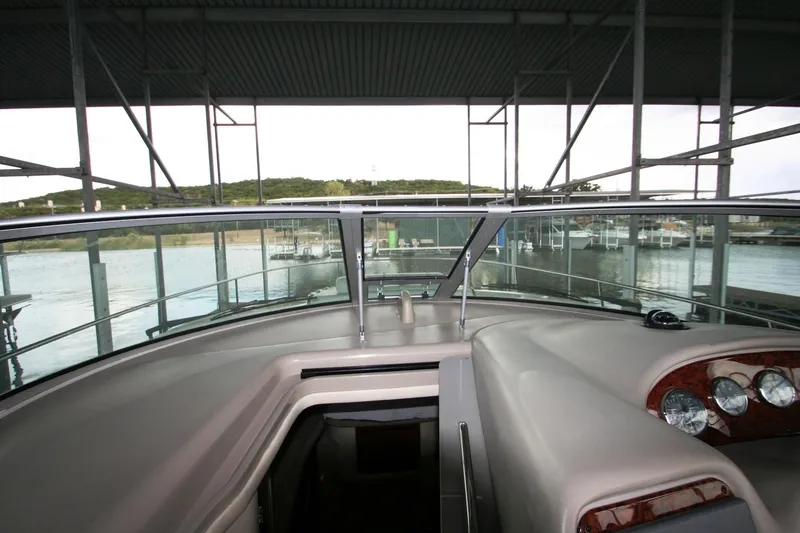 Slide: The Image of 2007 Sea Ray 320 Sundancer docked in a marina with scenic water view. - 34