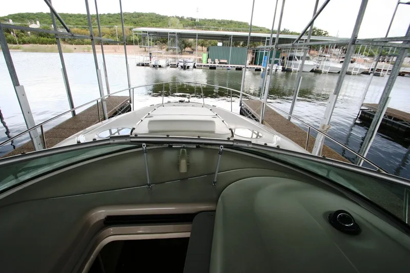Slide: The Image of 2007 Sea Ray 320 Sundancer interior with kitchenette and wood flooring. - 35