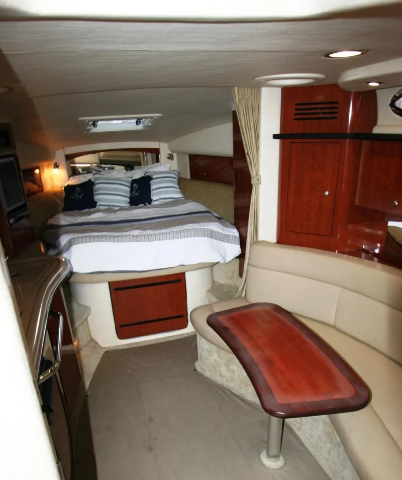 Slide: The Image of Interior of 2007 Sea Ray 320 Sundancer with cozy bed and elegant seating area. - 5