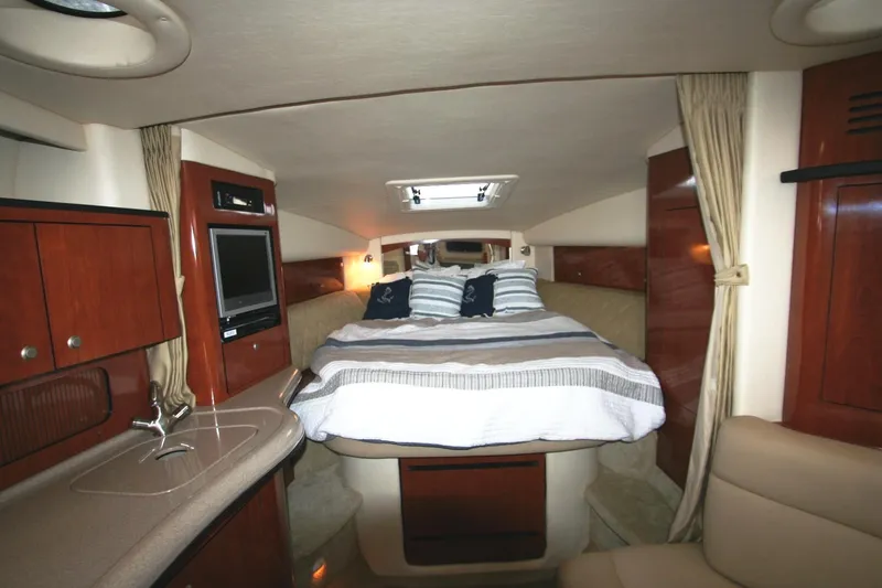 Slide: The Image of Luxurious interior of 2007 Sea Ray 320 Sundancer yacht with cozy bed and elegant wood finish. - 7