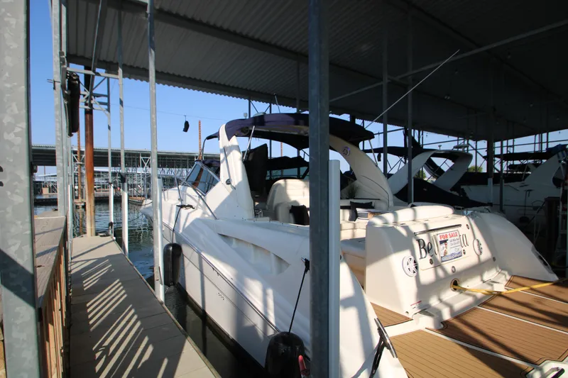 The Image of 2006 Sea Ray 400 Sundancer cruising on open water under clear blue skies. - 0