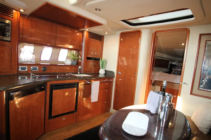 Slide: The Image of Luxurious interior of 2006 Sea Ray 400 Sundancer yacht with leather seating and elegant decor. - 11