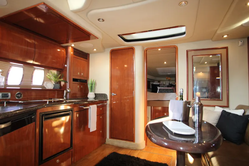 Slide: The Image of Luxurious 2006 Sea Ray 400 Sundancer yacht interior with modern kitchen amenities. - 17