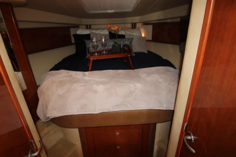 Slide: The Image of Luxurious interior of 2006 Sea Ray 400 Sundancer yacht with elegant seating and table. - 23