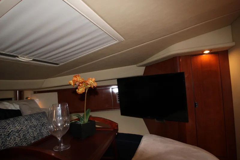 Slide: The Image of Luxurious cabin interior of 2006 Sea Ray 400 Sundancer yacht with cozy bedding. - 24