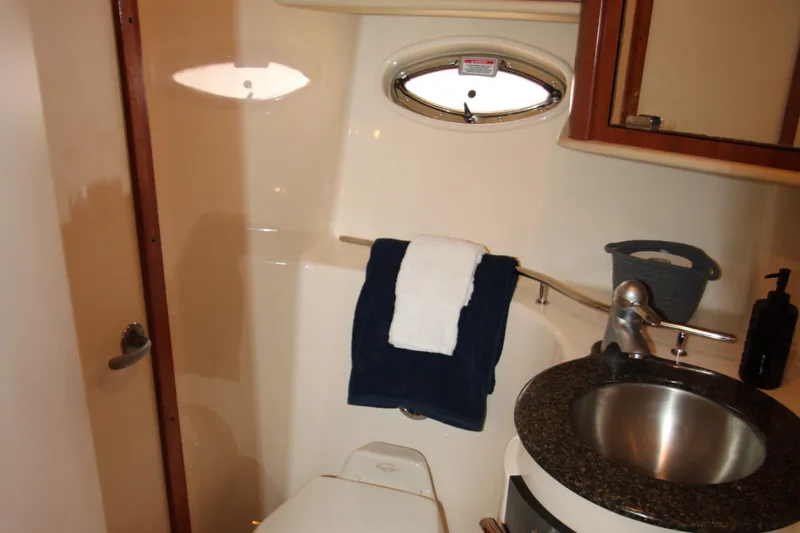 Slide: The Image of Luxurious cabin interior of 2006 Sea Ray 400 Sundancer yacht with cozy bedding. - 26