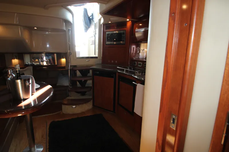 Slide: The Image of Shower area in 2006 Sea Ray 400 Sundancer yacht with window and toiletries. - 31