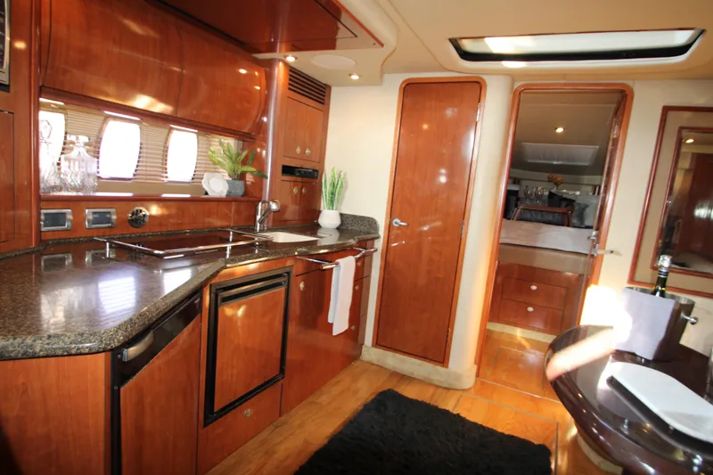 Slide: The Image of Interior of 2006 Sea Ray 400 Sundancer yacht with cozy seating and elegant wood finishes. - 34