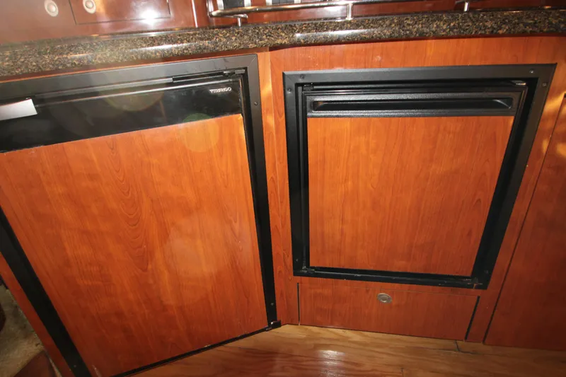 Slide: The Image of Luxurious interior of 2006 Sea Ray 400 Sundancer yacht with elegant wood finishes. - 38