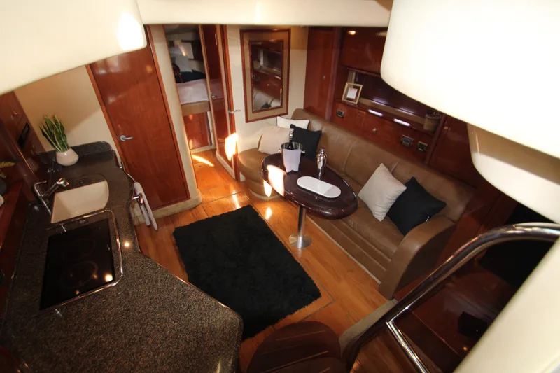 Slide: The Image of 2006 Sea Ray 400 Sundancer yacht docked in a marina, partially covered. - 4