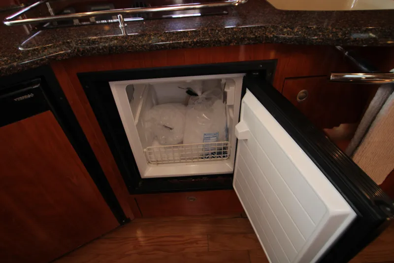 Slide: The Image of Wood-paneled kitchen area in 2006 Sea Ray 400 Sundancer yacht. - 40