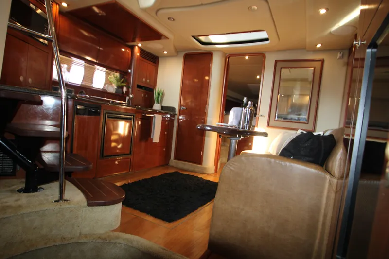 Slide: The Image of Interior of 2006 Sea Ray 400 Sundancer with TV, sofa, and ambient lighting. - 46