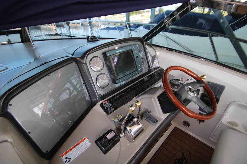 Slide: The Image of Luxurious interior of 2006 Sea Ray 400 Sundancer yacht with modern kitchen and seating area. - 48