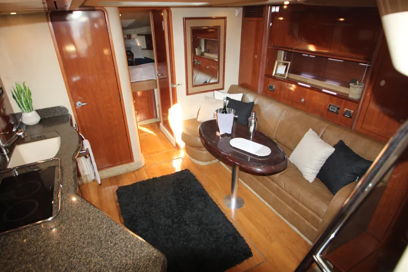 Slide: The Image of 2006 Sea Ray 400 Sundancer yacht interior with plush seating and modern design. - 5